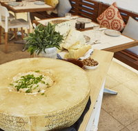 Flaming Cheese Wheel and Wine Experience Broadway - Accommodation Ballina